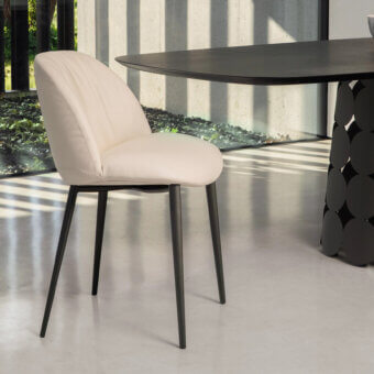 Exceptional Tonin Casa Olympia chair crafted in light off-white textile with quilted detail and dark matte metal legs