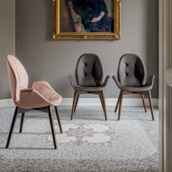 Distinguished Tonin Casa Sorrento armchair with dark gray textile upholstery and warm oak finished ash wood structure