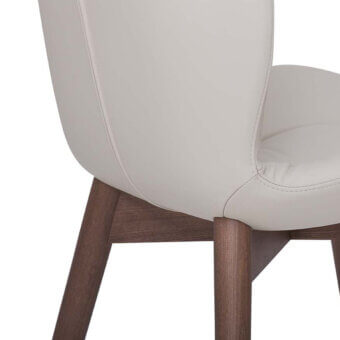 Elegant Tonin Casa Sorrento chair in smooth matte leather with a satin sheen ash wood frame