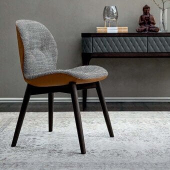 Superior Tonin Casa Sorrento Ésprit chair with textured gray textile and tan accents built with dark-stained wood legs