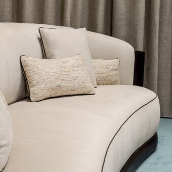 Sophisticated Bellotti Ezio 2026-01 sofa in cream matte Tecnabuk with brown piping, glossy hide base and textured beige gold cushions