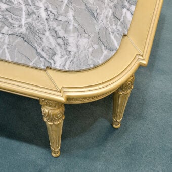 Luxury Bellotti Ezio coffee table with Antigua marble top, white meringue and patinated gold leaf finish, gold legs with carved scrollwork