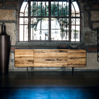 Exceptional Riva 1920 Rialto Fly sideboard built with blockboard and solid wood in a warm medium-brown finish with slender dark iron legs