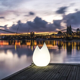 Distinguished Serralunga Flame floor lamp sculpted from bright white LLDPE with a matte finish and gently curved form
