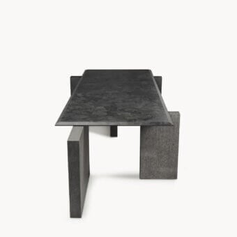 Luxury Visionnaire Axiom table with charcoal grey granite top, textured leather finish, beveled edges, bases, flamed Nero Zimbabwe stone plate