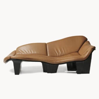 Innovative Visionnaire Blob sofa with robot‑sculpted fluid profile in tan leather and black lacquer shell