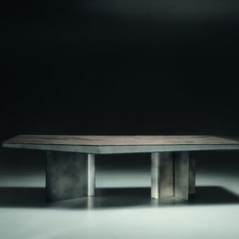 Luxury Visionnaire Catskill table with polished stone slab in muted brown‑grey tones and satin‑finished metal legs