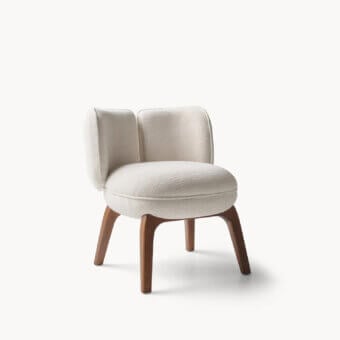 Premium Visionnaire Fantino chair with cream‑off white nubby textile, solid stained ash legs and curved silhouette