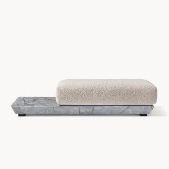 Luxury Visionnaire Prelude bench with polished stone plinth, off‑white cushion, stainless steel accents and dark wood frame
