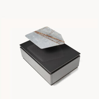 Luxury Visionnaire Prelude nightstand with glossy lacquered wood core, inclined marble plinth, stainless steel profile, dark top, light grey base, floating marble slab veined grey‑white, brown and rust accents