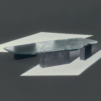 Sophisticated Visionnaire Stealth coffee table with light-grey textured glass and dark charcoal split Moltrasio stone