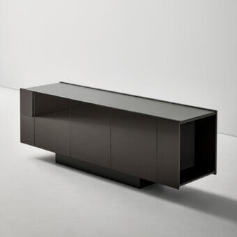 Luxury Bonaldo Spy sideboard with deep charcoal lacquered wood, glossy finish, angular lines and recessed plinth