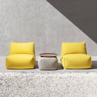Elegant Gart Puffone Lounge Chair with bright yellow high-performance outdoor fabric and integrated side pocket