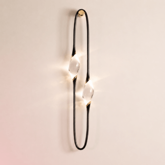 Luxury Il Pezzo Mancante 12 wall lamp with slender brass frame, engraved serial, crystal diffusers, and warm radiance