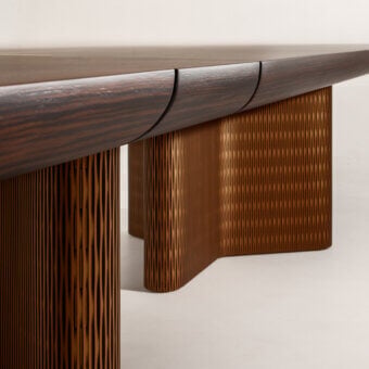 Architectural Laurameroni Infinity Air table with deep dark-brown grain wood top and bronze-toned Lacca 61 honeycomb base