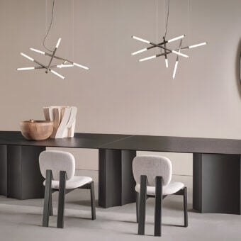 Sophisticated Sovet Italia Willow Cross suspension lamp in dark charcoal matte metal with bright white illuminated tips