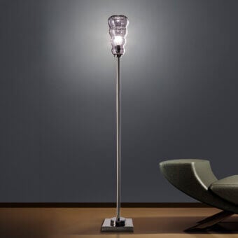 Sophisticated Euroluce Vogue floor lamp with reflective silver-toned metal stem and textured undulating glass shade