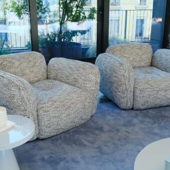 Sophisticated Furla Casa Moonstone lounge chair in light grey speckled textured textile with black beech wood feet