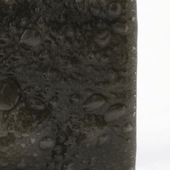 Distinguished Glas Italia Opalia table with deep charcoal bronze acid-etched velvety matte smooth surface