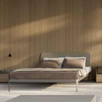 Elegant Kristalia AluAlu Bed with lacquered light gray metal frame, textured muted taupe headboard, slender cylindrical legs
