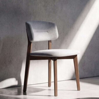 Architectural Ozzio Italia Ego chair in light gray textured textile with rich brown tapered wooden legs and tufted backrest