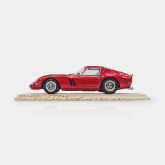 Sophisticated Vèlle Milano Ferrari 250GTO decorative model in glossy red with silver metal wheels and matte cream porous base