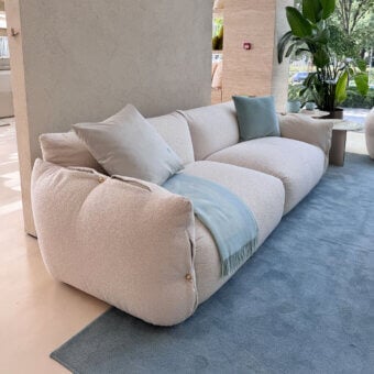 Exquisite Furla Casa Cherry Blossom sofa in off-white textured textile with organic silhouette and black beech wood feet