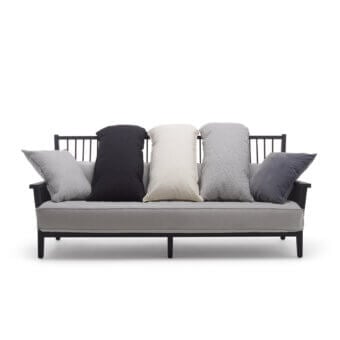 Sleek Gervasoni Gray 03 sofa in matte black ash wood with a linear slatted backrest and cream down cushions