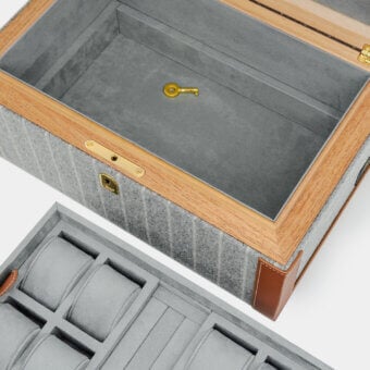 Exquisite Vèlle Milano Watch Case Grand in grey striped Loro Piana fabric with brown leather trim and polished gold hardware