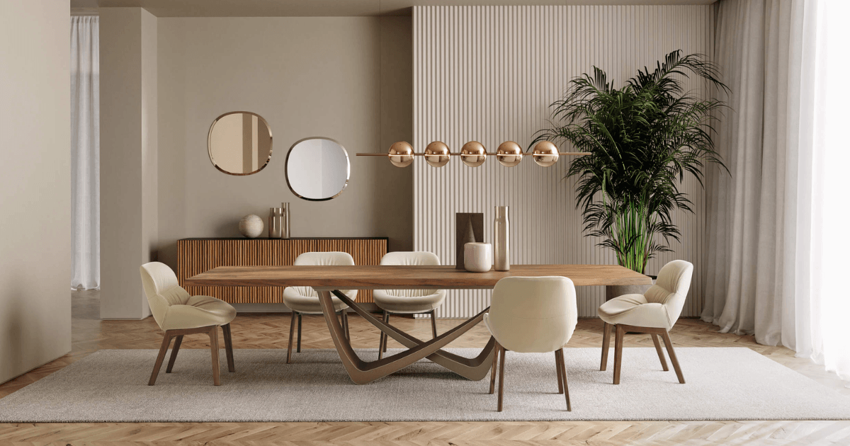 Lighting follows the length of the table, while the rug establishes a shared footprint for the dining arrangement.