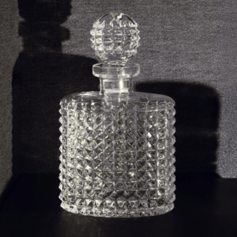 Exquisite John Richmond bottle in clear 24% lead crystal with geometric hobnail pattern and matching spherical stopper