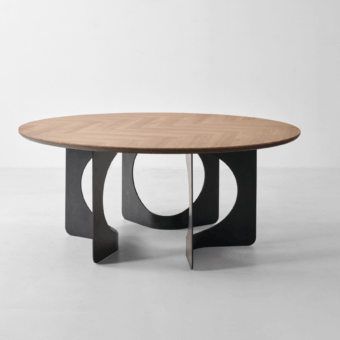 Luxurious Modesign Hole table featuring round silhouette with medium brown wooden top and dark grey metal base