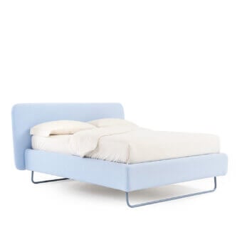 Elegant Noctis Doxy Wide bed in light blue textile upholstery featuring rounded headboard and metal base
