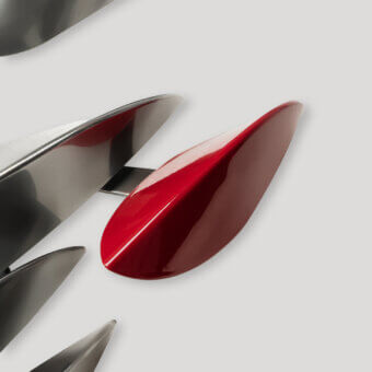 Exquisite Paolo Castelli Anodine Imago wall lamp featuring eleven handmade steel leaves with vibrant red lacquer