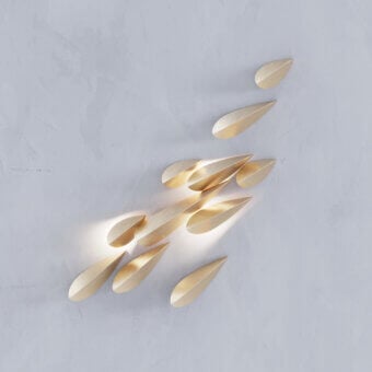 Sophisticated Paolo Castelli Anodine wall lamp featuring organic metal leaf elements in satin gold finish