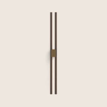 Exquisite Paolo Castelli Fair wall lamp featuring tubular metal and bronze brass mounting block