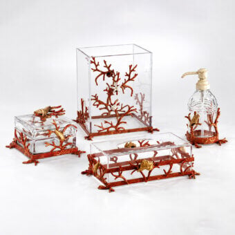 Luxury Selezioni Domus Corallo bathroom set in transparent containers with reddish-orange gold sculptural coral motifs