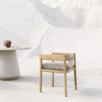 Exquisite Unopiù Cora chair in solid teak with matte light toned finish woven off white rope backrest and grey speckled…