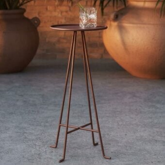 Luxury Unopiù Syros side table crafted in Italy from metal with a refined matte Terracotta finish and angled tripod legs