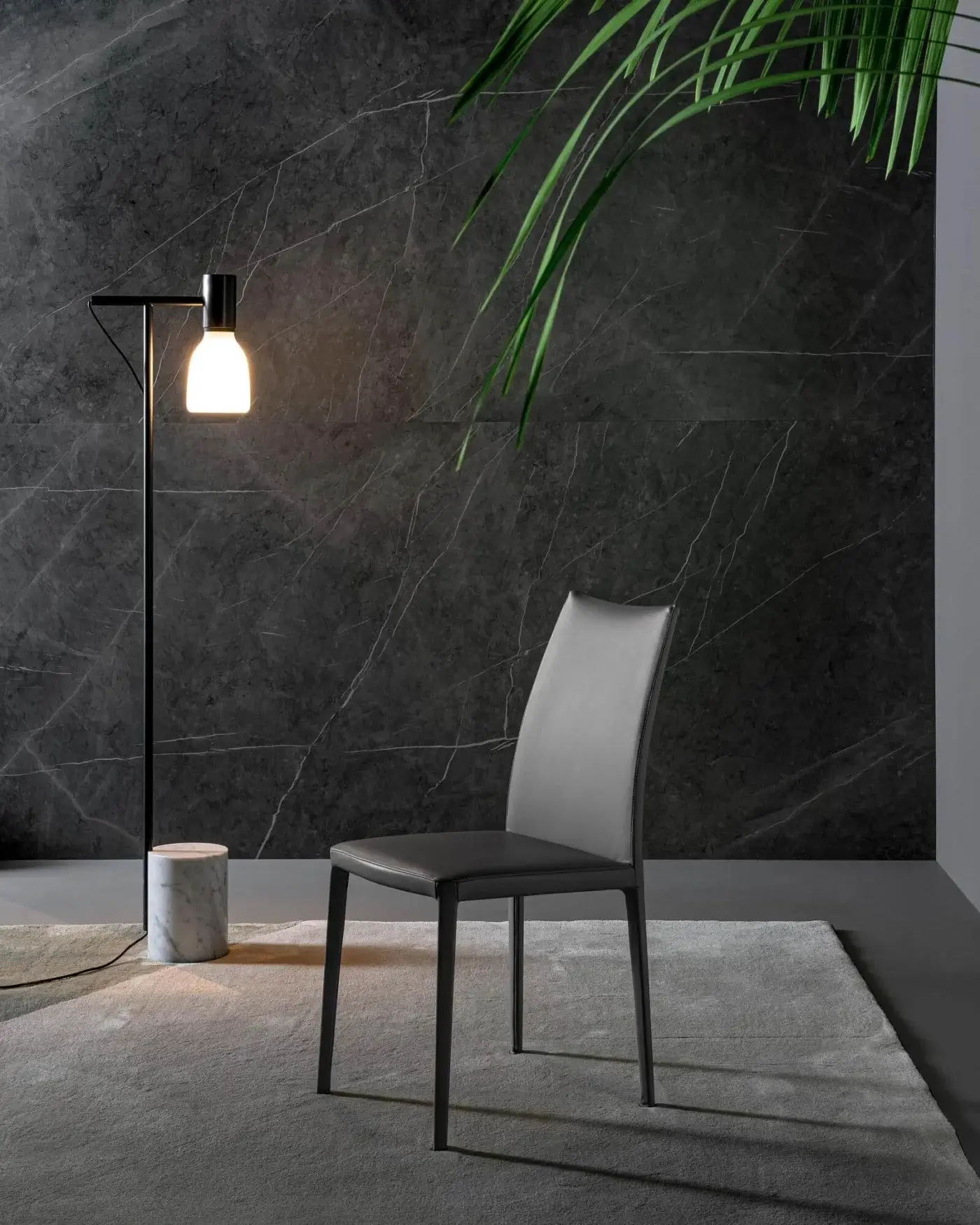 Elegant Bonaldo Kayla up chair showcases light gray fabric upholstery with a matte dark metal frame and legs