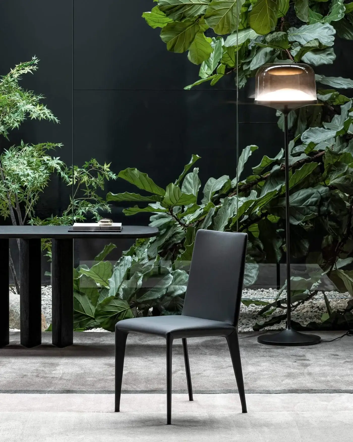 Elegant Bonaldo Filly chair with smooth dark gray fabric upholstery and slim dark gray metal legs