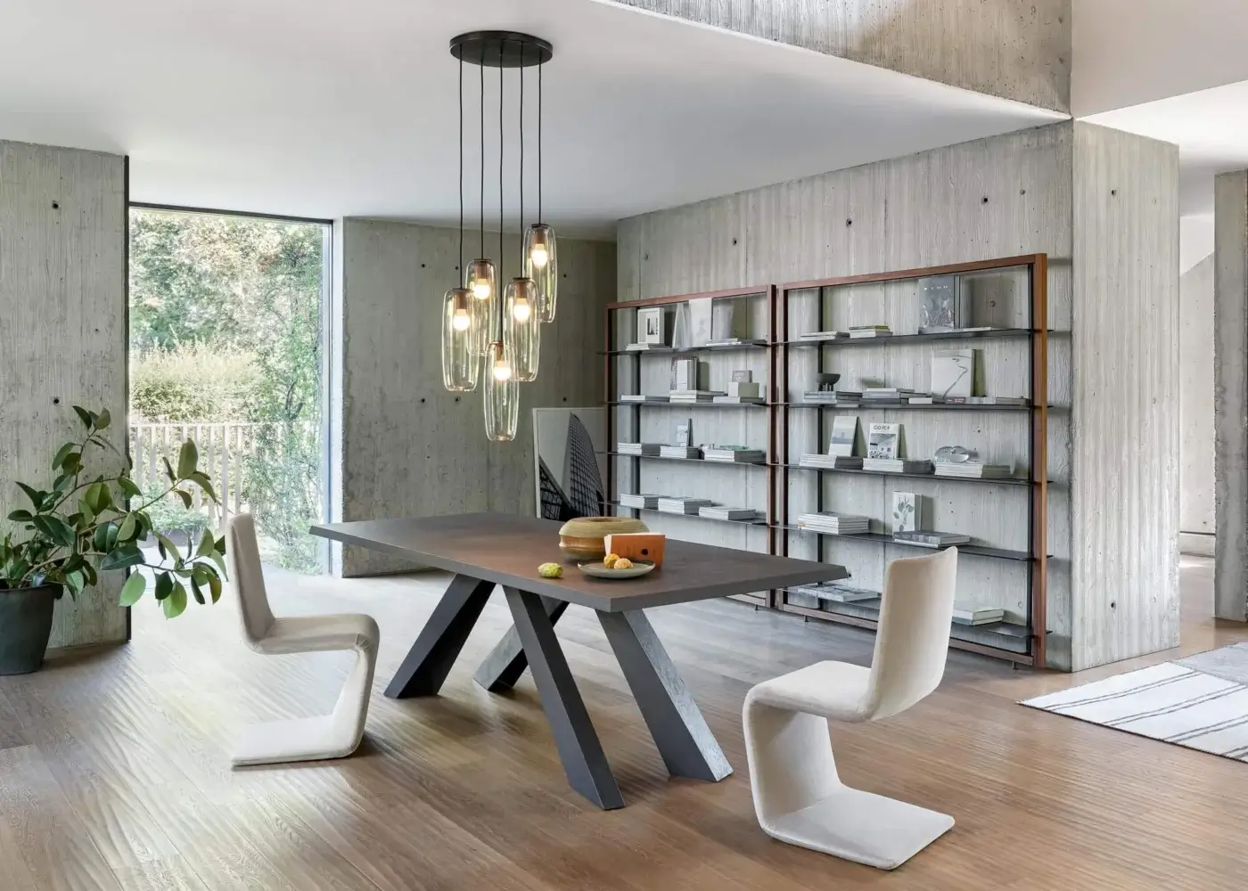 Exceptional Bonaldo Big table with hand-spatulated clay top and dark gray stone-like finish, showcasing intersecting angled legs