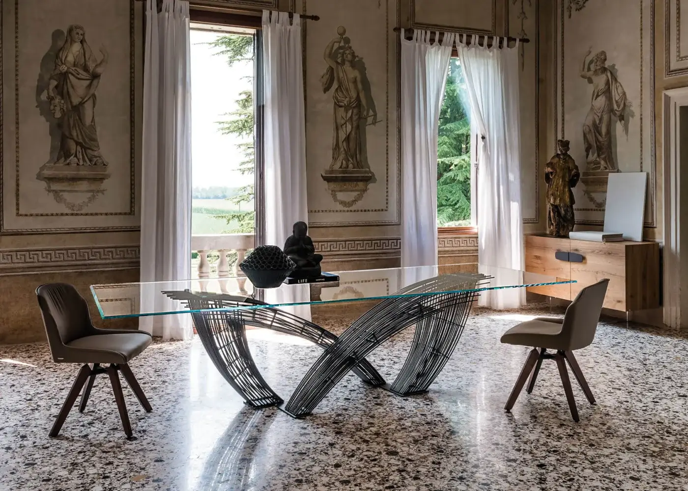 Exceptional Cattelan Italia Hystrix table crafted with a sculptural metal base and clear glass top in a dark gray matte finish
