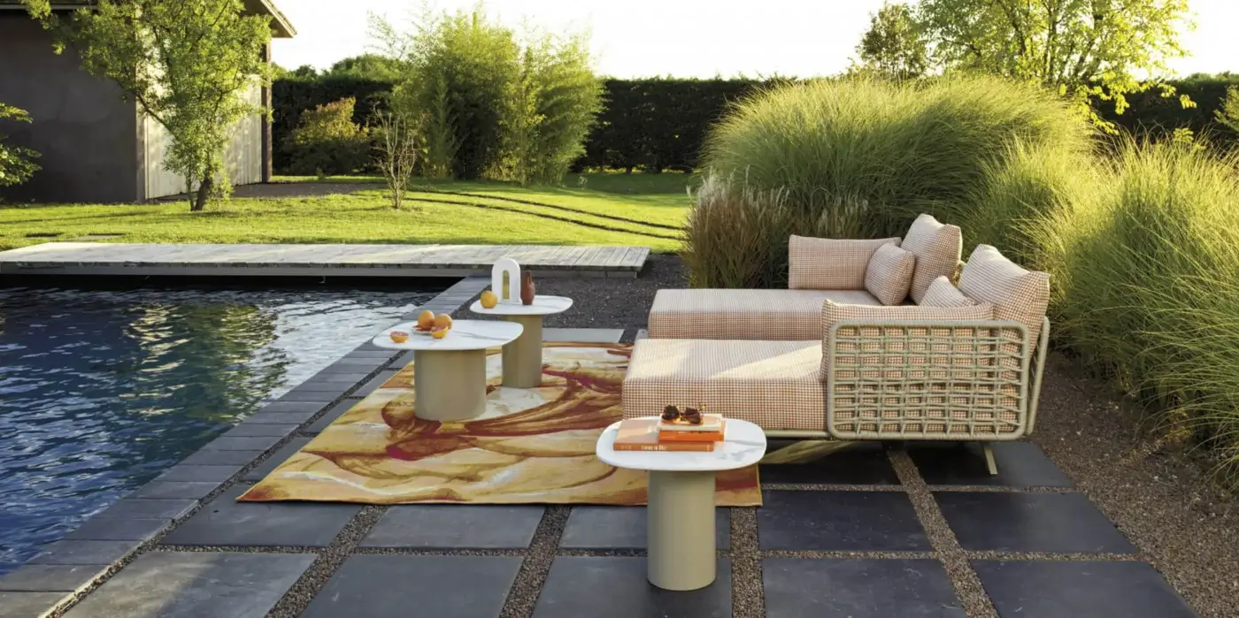 Distinguished Roberti Rattan Armàn coffee table crafted in Italy with a white marble effect tabletop and powder coated stainless steel base