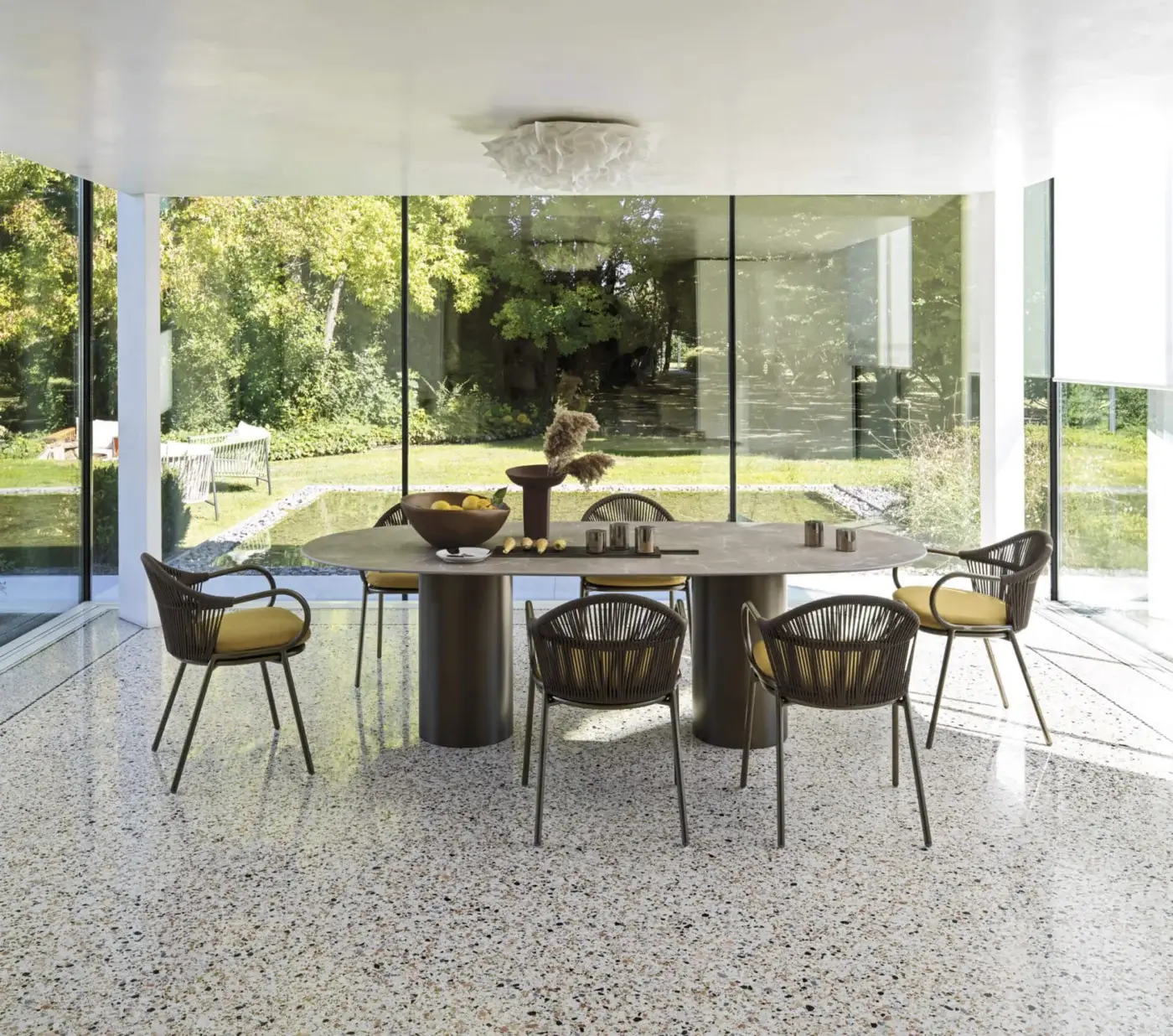 Exceptional Roberti Rattan armchair with yellow cushion and bronze-like powder-coated aluminum frame woven in Round Trendyrope