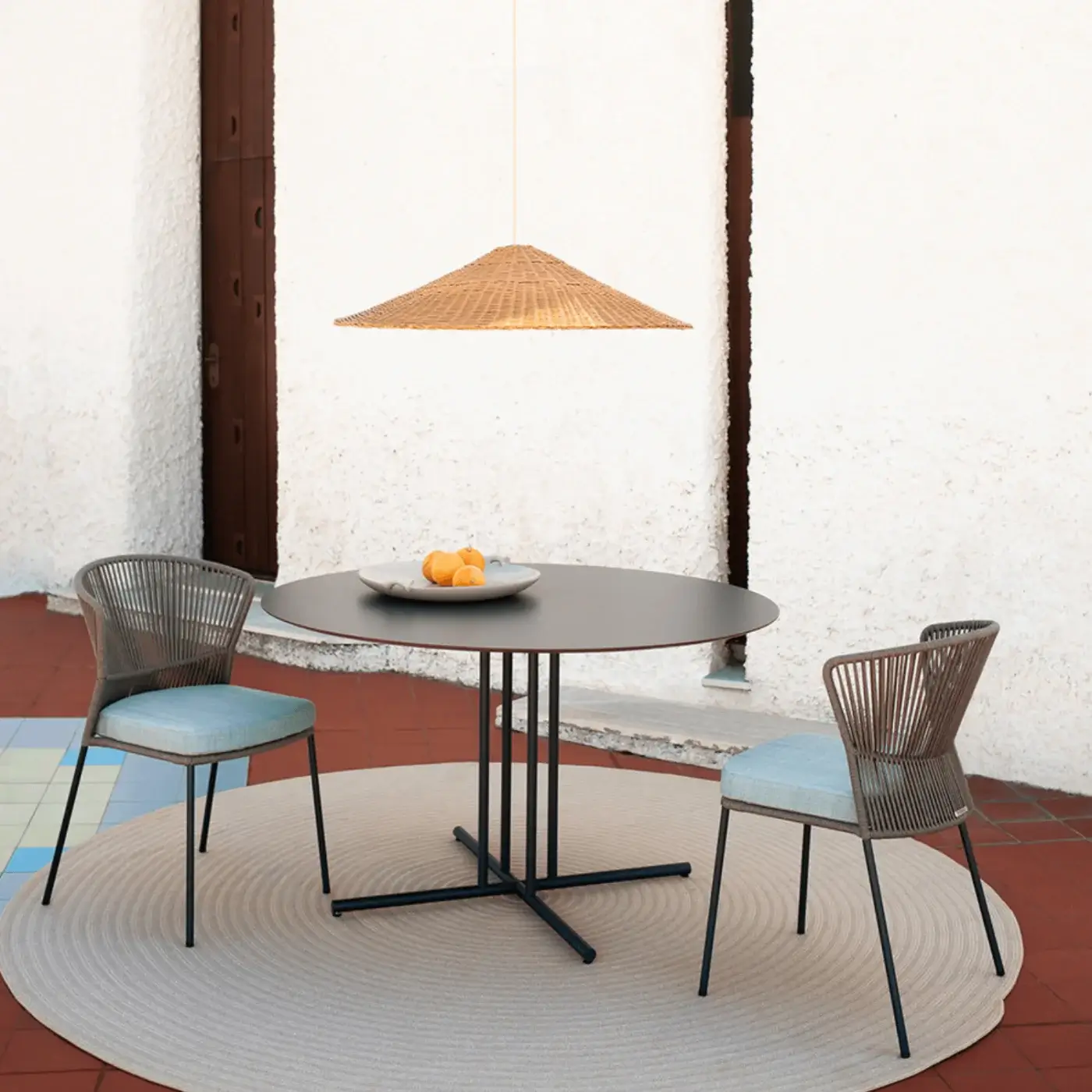 Distinguished Potocco Graphic dining table with a dark matte finish and slender painted metal base crafted in durable HPL