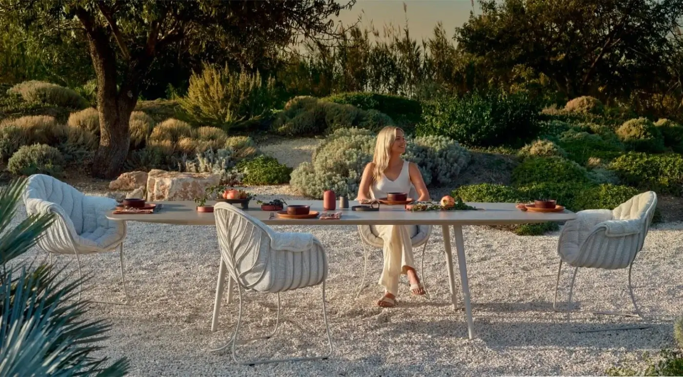 Distinguished Royal Botania Styletto table with an oval tabletop in a light natural tone and tapered ceramic legs
