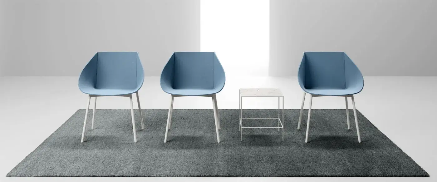 Elegant LaCividina Taco chair with a rounded felt seat in muted blue and crisp white metal legs