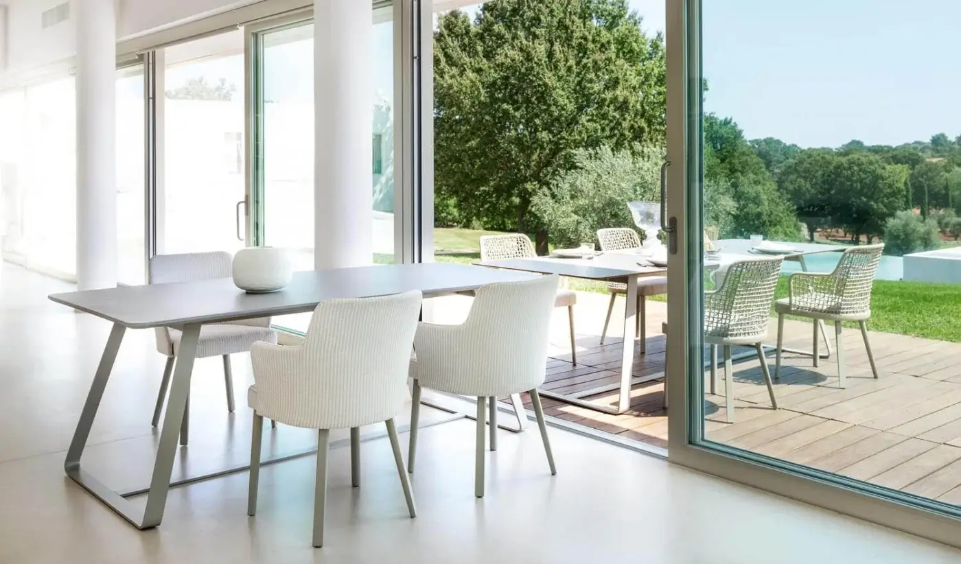 Exceptional Varaschin Emma armchair with neutral vertically striped Textilene and matte powder-coated aluminum legs