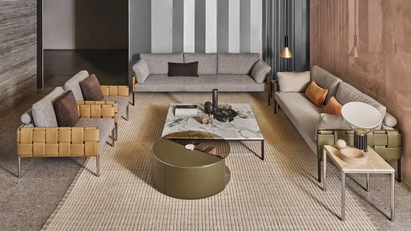 Exceptional Turri Ratio lounge chair with woven light tan leather and comfortable gray textile cushions built with a sleek metal frame